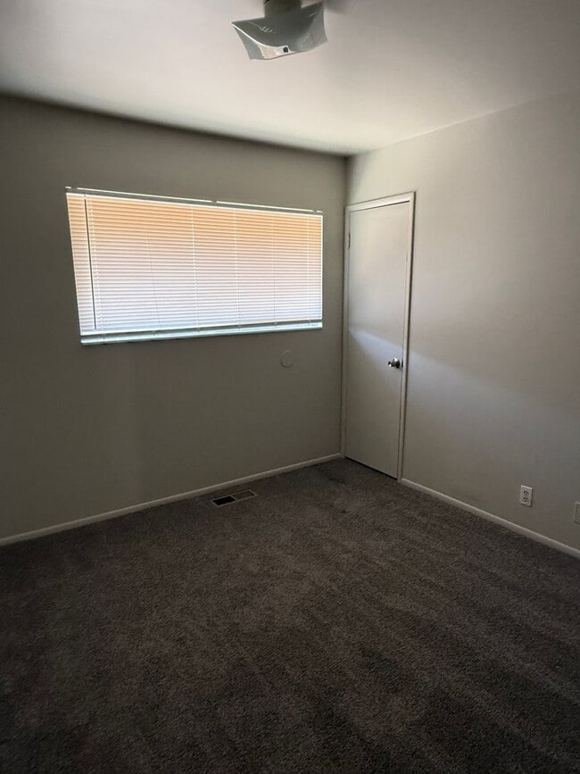 Building Photo - Beautiful town home with deep 2 car garage and a large covered patio