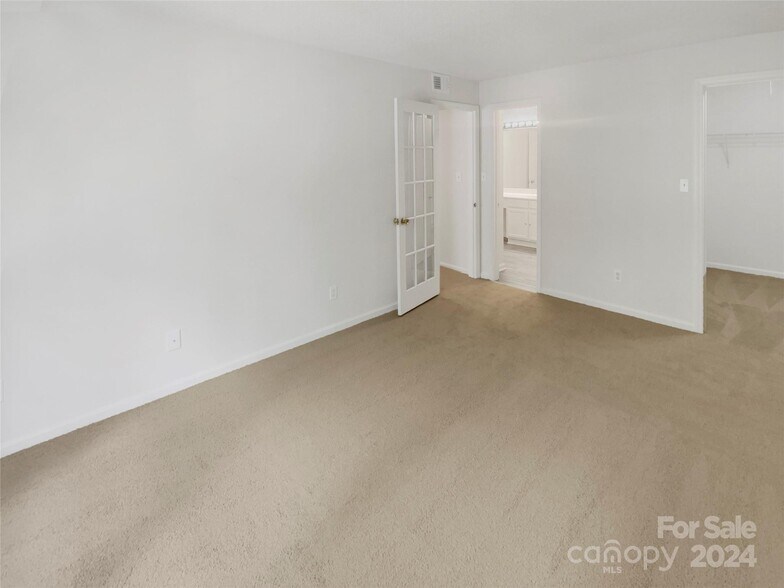 Primary Bedroom Looking Toward Bathroom - 6003 Treetop Ct