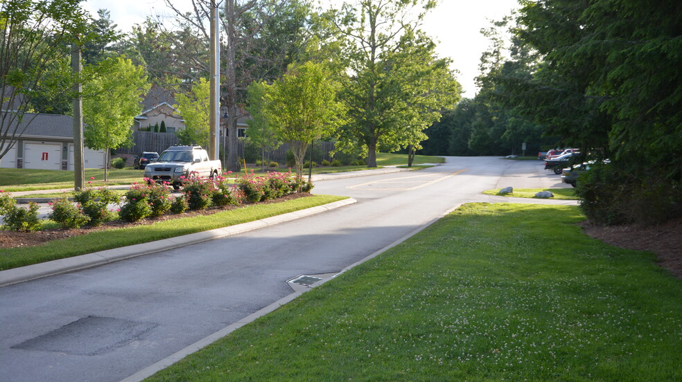 Street view looking towards condo unit. Ample parking at front of unit. - 17 Racquet Club Rd