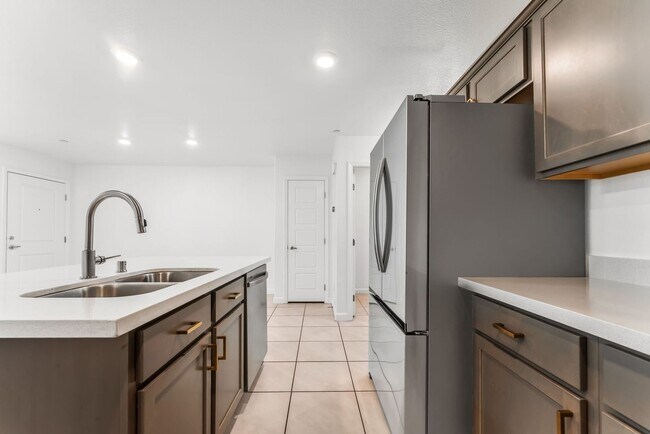 Building Photo - Modern Gated Townhome with Flexible Living Spaces & Stylish Finishes!