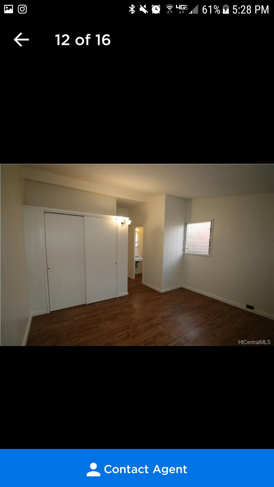 This is an older picture of the primary bedroom. It has since been repainted gray and has a split AC - 2277 Aumakua St