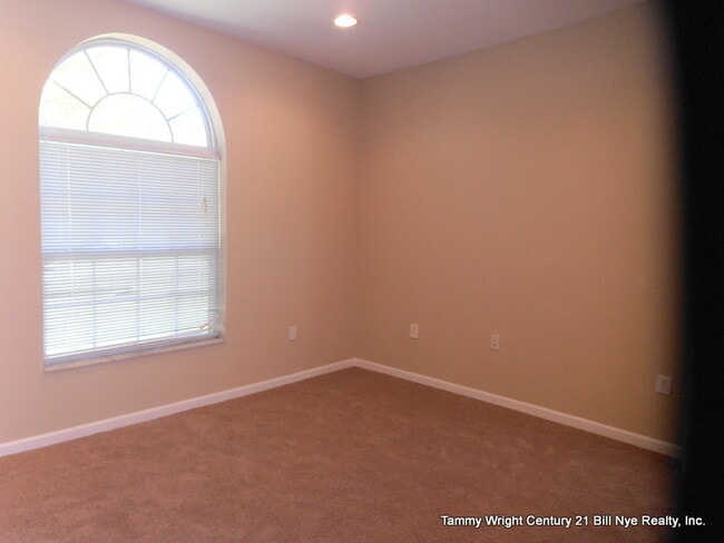 Building Photo - THREE BEDROOMS AND A TWO CAR GARAGE