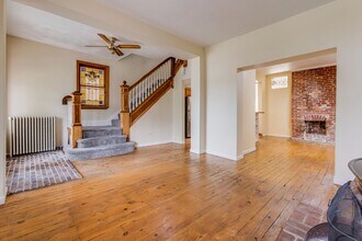 Building Photo - AVAILABLE June 2026 - Beautiful 4 Bedroom, 2 Bath Home w/ Front Porch Swing!