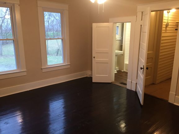 Bedroom with view of bathroom and walk-in closet - 4450 Homer Worsham Rd