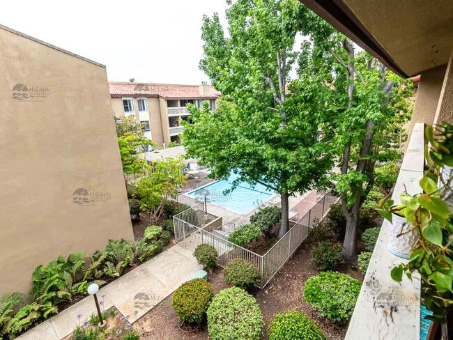 Building Photo - Top Floor Furnished Condo In The Heart Of ...