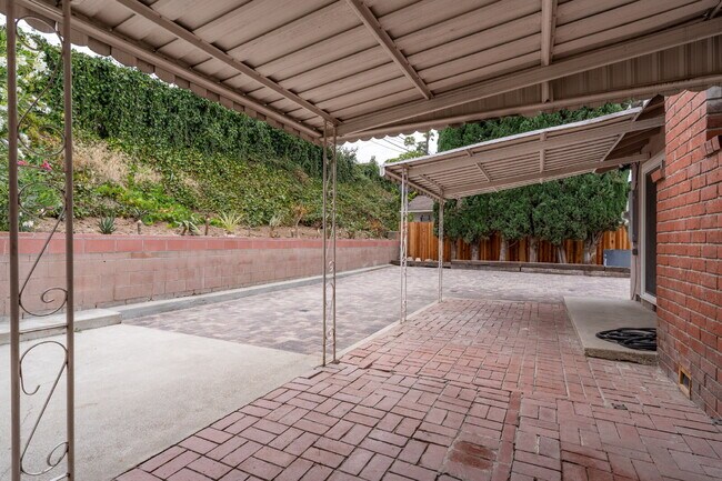 Building Photo - Charming Updated Home With Drive-Through Garage Access