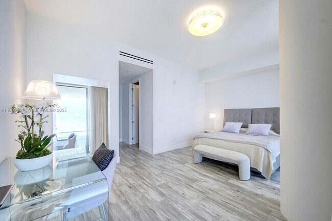 Building Photo - 10203 Collins Ave