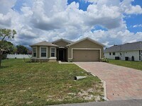 Building Photo - Nice 3 bed 2 bath 2 car garage single family home in Cape Coral with lawn care included.