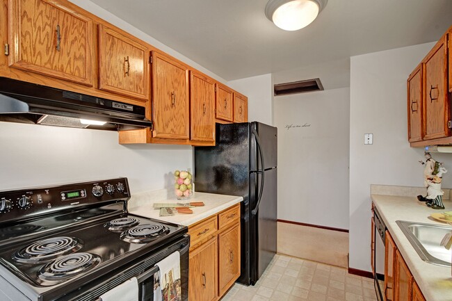 Sunset Ridge Kitchen View with Oven and Fridge - Sunset Ridge