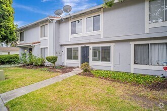 Building Photo - 2-story condo featuring 2 bedrooms and 1.5...
