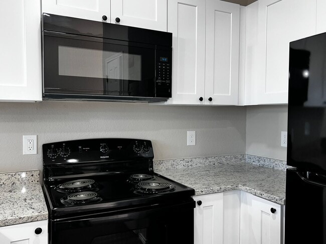 Building Photo - Modern 3BR Townhome w/ Garage, Private Yard & No Carpet – Built 2022