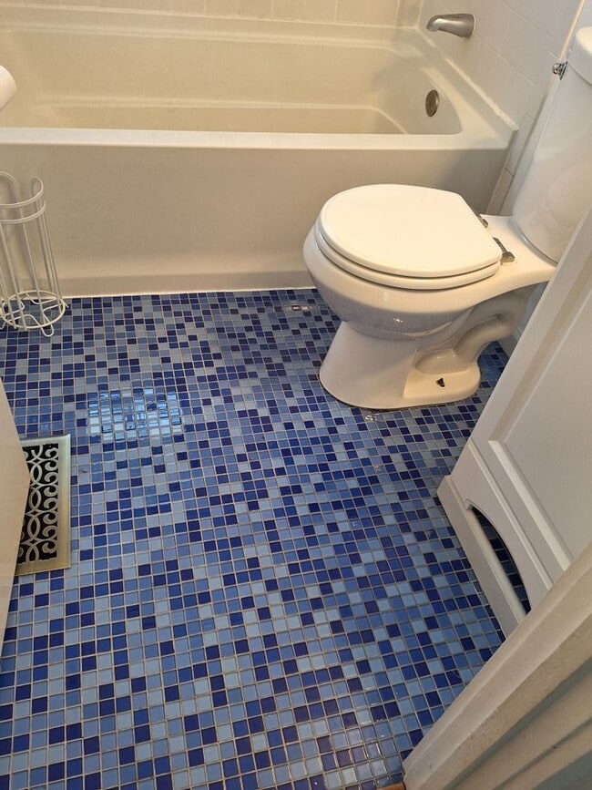 Building Photo - Cute white cottage with white picket fence & Huge deck off back door!