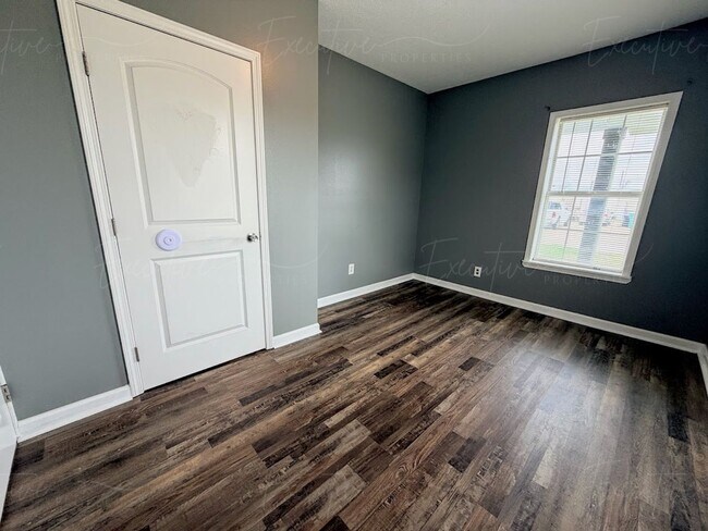 Building Photo - Move-In Ready in Sulphur | Updated 2BR Home w/ Covered Front Porch + Granite Countertops