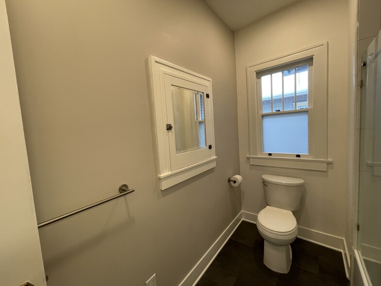 restored original built-in cabinet in bathroom - 508 Daly Ave