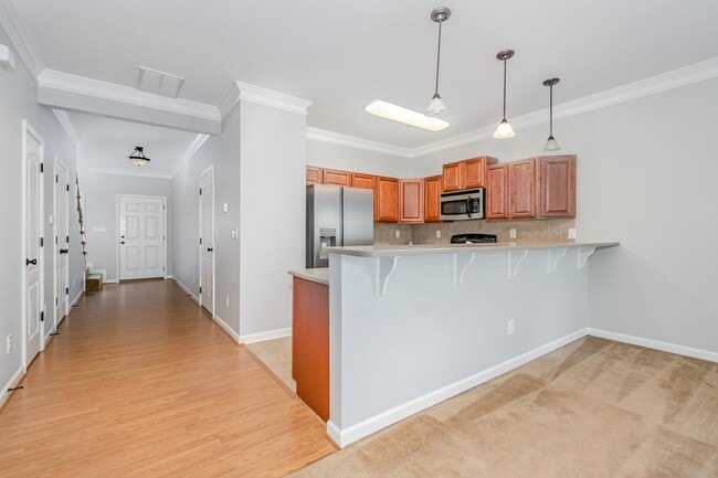 Building Photo - Spacious 2-Story Townhome with Finished Ba...