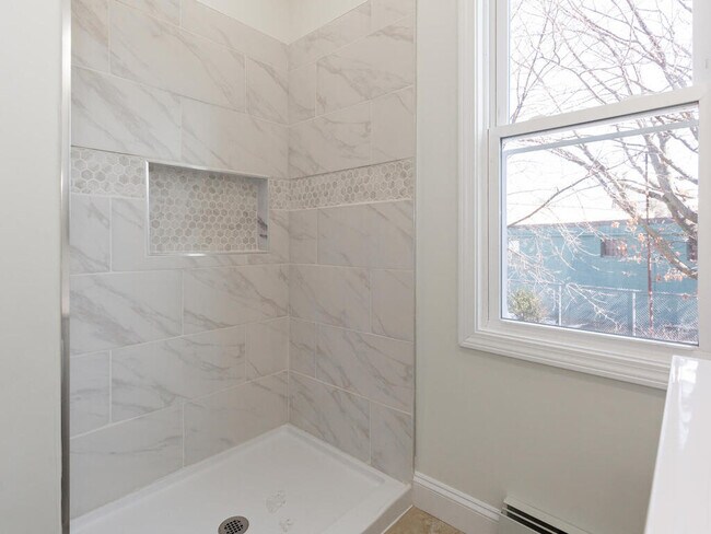 These photos are from Unit #2, but the bathroom in Unit #3 is equally as updated; the colors do vary - 33 Valley St