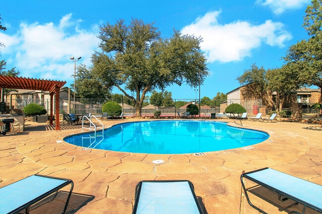 Pool with lounge chairs - Advenir at The Meadows