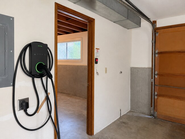 Building Photo - Beautiful Split-Level Home with Fireplace, Deck, Garage, and EV Charger