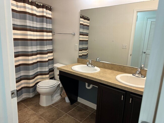Building Photo - Spacious 4-Bedroom Home with Fantastic Ame...