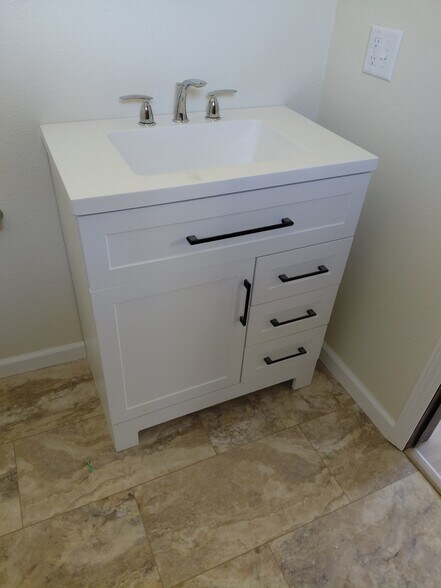 New bath cabinets and fixtures - 813 Eastmoor Dr