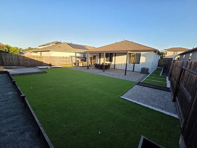 Building Photo - This stunning three-bedroom, two-bathroom home offers an incredible amount of space and upgrades,...