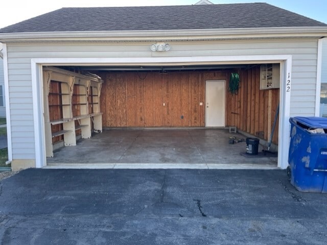 Garage with shelving unit for storage. - 122 Shay St