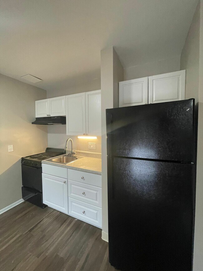 Experience the charm of this modern kitchen, perfect for gourmet adventures. - GRACE LANDINGS APARTMENTS