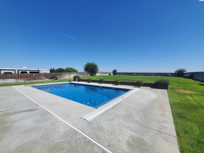 Building Photo - FOR RENT: West Pasco with heated inground ...