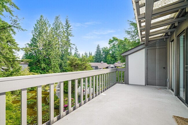 Building Photo - Top-Floor Condo with Forest Views, Large Private Deck & Resort-Style Amenities