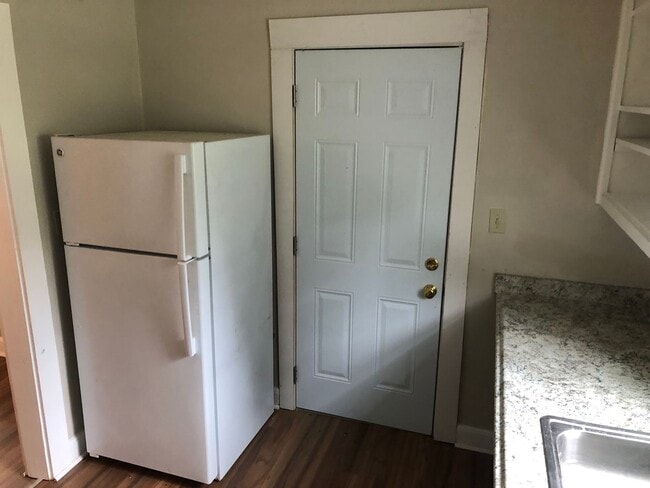 Building Photo - Freshly Painted 2x1 with Brand-New Plank F...