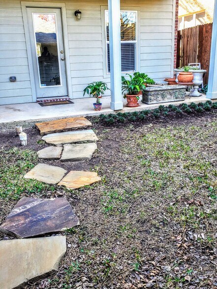 Back yard & patio leading from 2-car garage to house - 3426 W 4th St