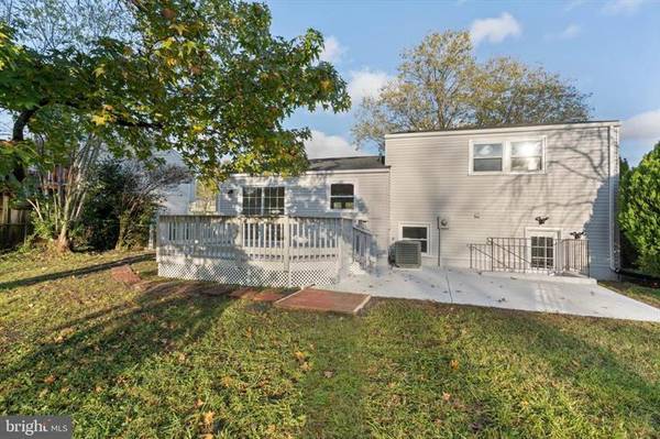 View of the house, deck, and private entrance to the basement unit. - 7922 Fitzroy St