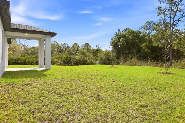 Building Photo - Brand New 4-Bedroom Gem with 2 Full Baths on Large Lot in Lehigh Acres – A Perfect Family Haven!
