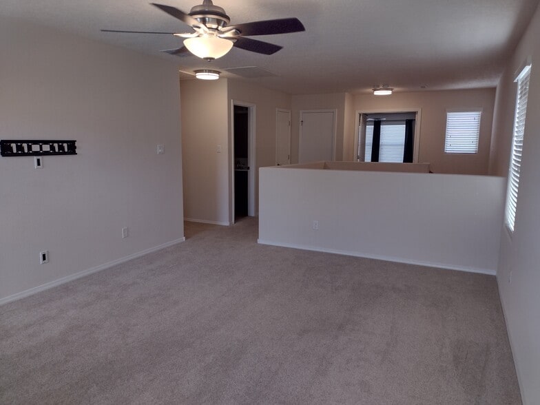 Loft, facing stairs & MBr, with second BR and Bath on left - 10824 Arguello Trl NE