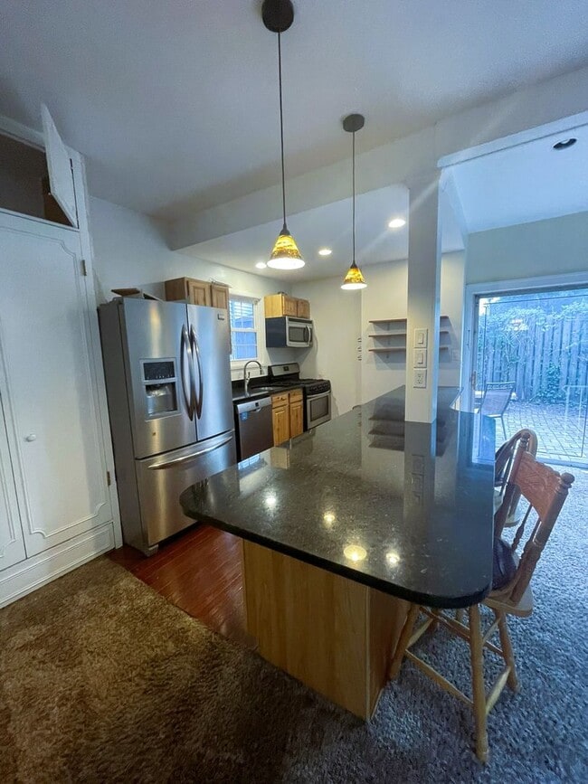 Building Photo - One Block to the Diag! Charming Home with Private Courtyard + Parking