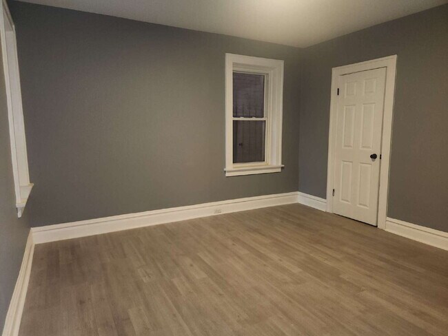 Building Photo - Charming & Spacious Updated Brick Home – P...