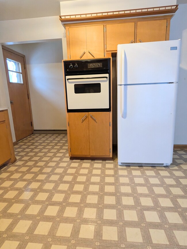 Photo 2 of kitchen shows off the built-in oven. - 910 Maple St