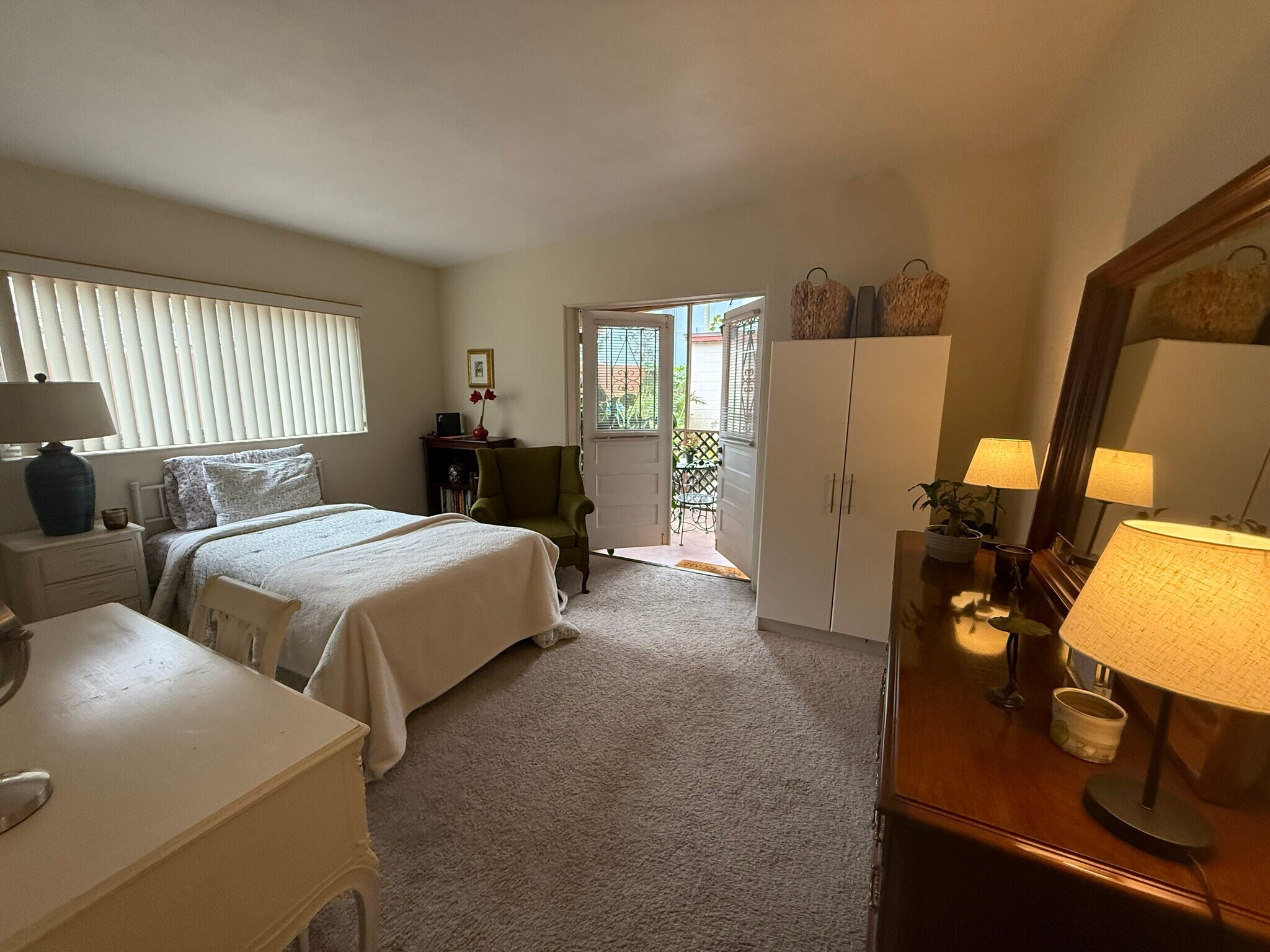 Large master bedroom, French doors open to screened porch - 1010 Delaney Ave