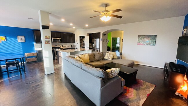 Spacious open concept with fan, floor outlet, and walk-in pantry - 7108 Garnet Mill Ln