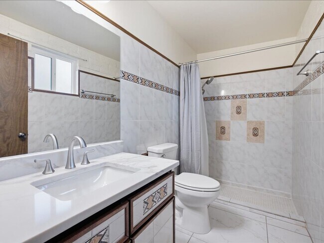Building Photo - Concept Living with Large Enclosed Backyard & Modern Upgrades!