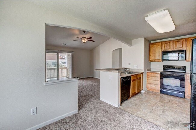 kitchen and living - 4815 Hahns Peak Dr