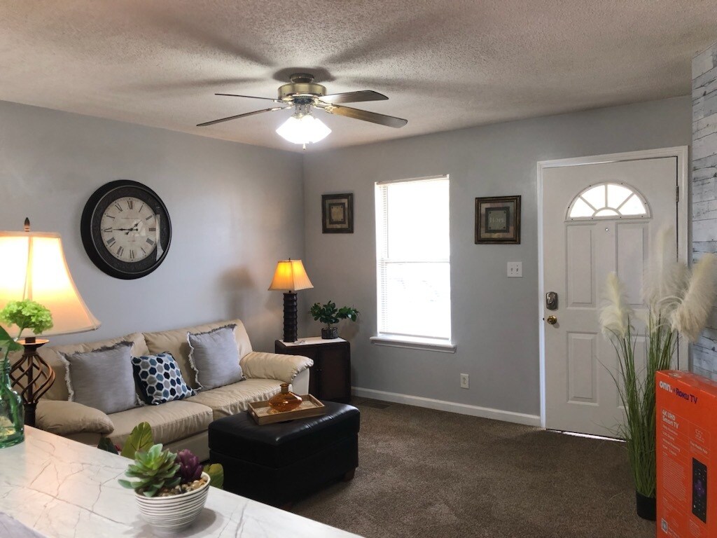 Comfortable living room with ceiling fan. - 324 Atlantic Ave