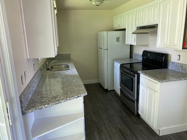 Primary Photo - 4 Bedroom, 2 Bathroom House with Large Fenced Backyard, New Vinyl Plank Flooring, Granite Counter...