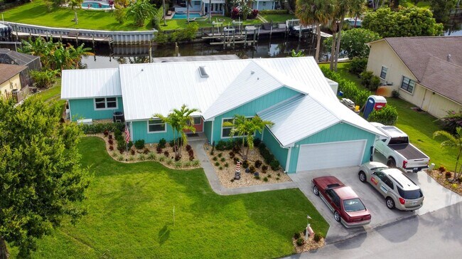 Building Photo - Palm City Home with Dock and Lift