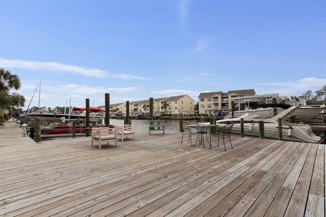 Building Photo - Welcome to Harbor Landing Condominiums — where coastal living meets convenience!