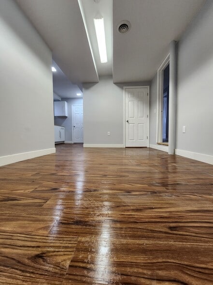 Living room opens to kitchen - 7302 Columbia Ave