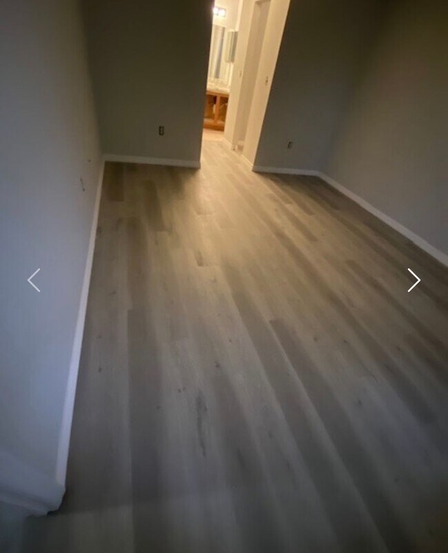 Building Photo - Available NOW! NEW FLOORS AND PAINT! Lovely 3/2 in Poinciana! HUGE fenced yard and NO CARPET!