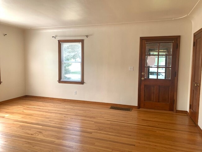 Building Photo - Three bedroom home with beautiful hardwood floors and central air!