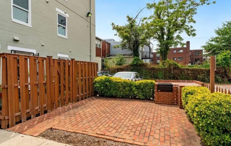 Backyard community patio with grill - 730 11th St NE