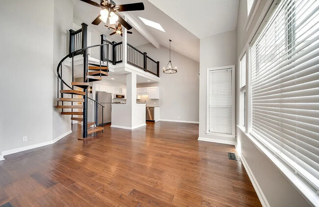 View of loft and kitchen and dining from front door - 129 Cherry Hill Dr